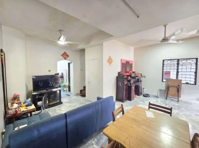 Living features: blue fabric sofa, wooden dining table, 4 wooden chairs, TV console, wall-mounted TV, ceiling fan, marble flooring, white painted walls, decorative wall art. Room features: doorway leading to another room, staircase visible in background.