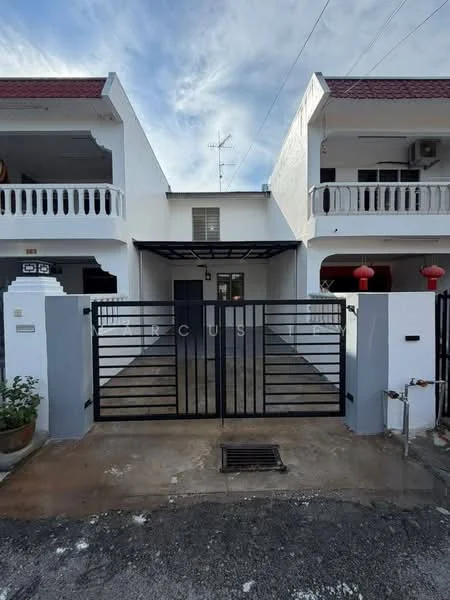 Exterior type: linked terrace house; features: white painted facade, red tiled roof, black metal gate, paved driveway, two-storey structure, balconies with white railings, visible air conditioning unit, decorative lanterns at entrance, manicured plants at entrance; style: modern.