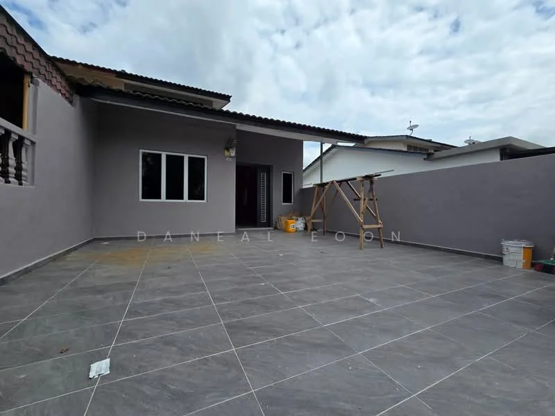 Exterior features: grey tiled flooring, plain grey painted walls, flat roof, large windows, open outdoor space, wooden frame structure, construction scaffolding, paint buckets, manicured edges; style: modern.