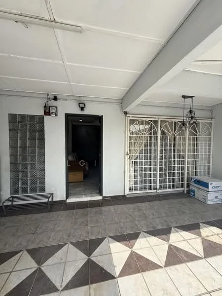Exterior features: tiled flooring with geometric pattern, metal security grille door, wall-mounted light fixtures, exposed ceiling with beams, grey painted walls, entrance door leading inside, storage box on the floor; style: modern.