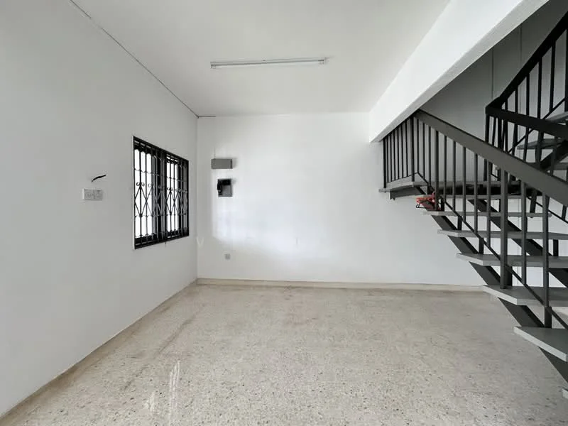 Room features: white painted walls, polished concrete flooring, metal staircase, large window with black grille, ceiling light fixture, open layout, no visible furniture, neutral color scheme; style: minimalist.