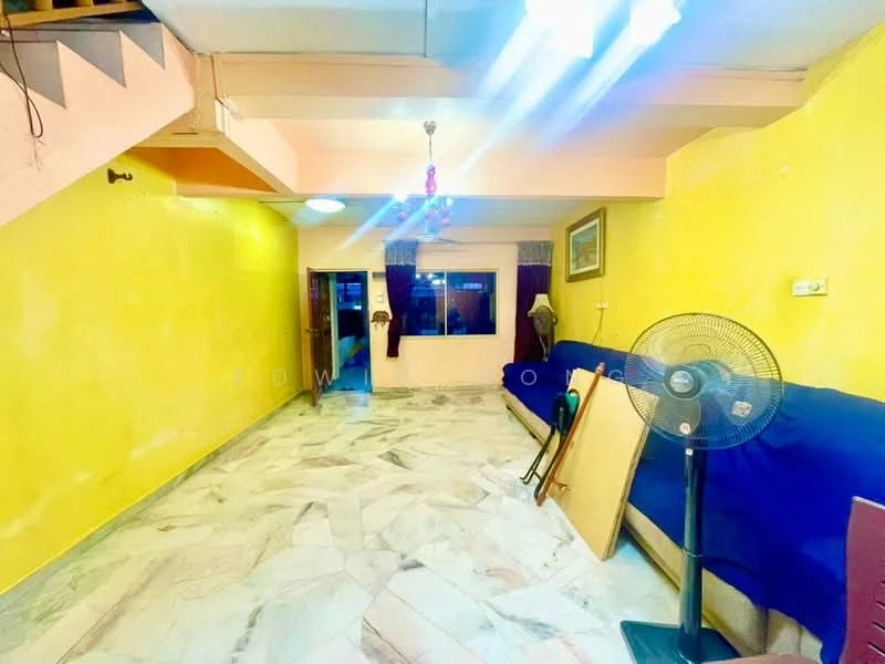 Living features: yellow painted walls, marble flooring, sofa in blue fabric, ceiling fan, chandelier, large window, curtains, decorative painting, folding table, standing fan.
