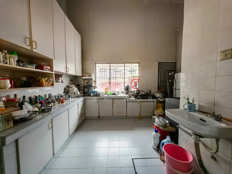 Kitchen features: white cabinetry with flat-panel doors, grey countertop, single-bowl stainless-steel sink, chrome faucet, wall-mounted shelves, tile backsplash, ceramic tile flooring, window with security bars, multiple cooking pots and utensils, kitchen appliances visible, various containers and bottles on shelves.