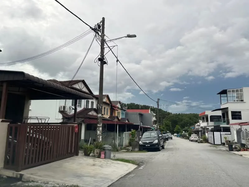 Exterior type: linked terrace house; features: two-storey linked terrace houses, paved driveway, front porch with wooden gate, street view with power lines, manicured landscaping, cars parked along the street, cloudy sky, greenery in the background; style: modern.