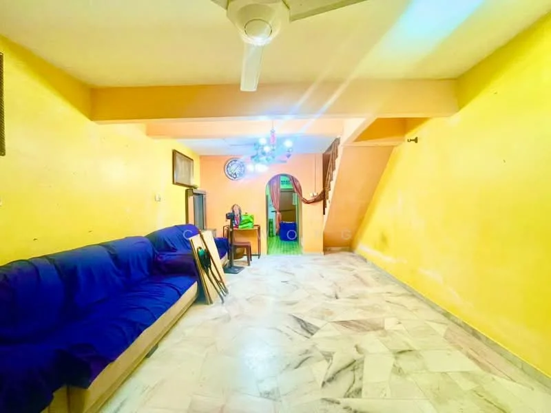 Living features: blue fabric sofa, marble flooring, yellow painted walls, ceiling fan, chandelier with multiple lights, arched doorway, decorative wall clock, open layout.