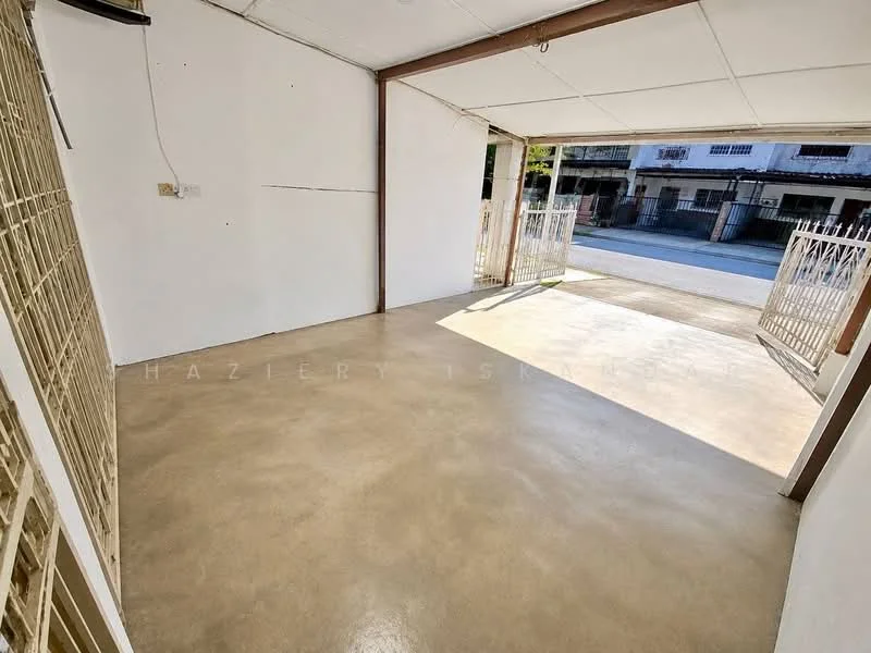 Room features: concrete flooring, white painted walls, metal gate, natural light from entrance, flat ceiling, no visible furniture, open space layout; style: minimalist; view: street.