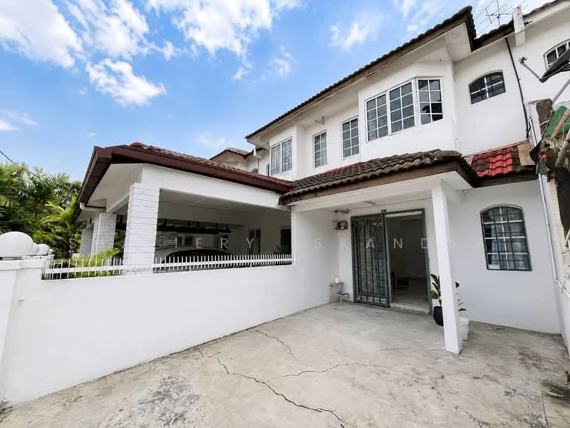 Exterior type: semi-detached house; features: white painted facade, red tiled roof, single-storey car porch, manicured lawn, fenced front yard, sliding metal gate, concrete driveway, multiple windows, balcony on upper floor, potted plants; style: modern.
