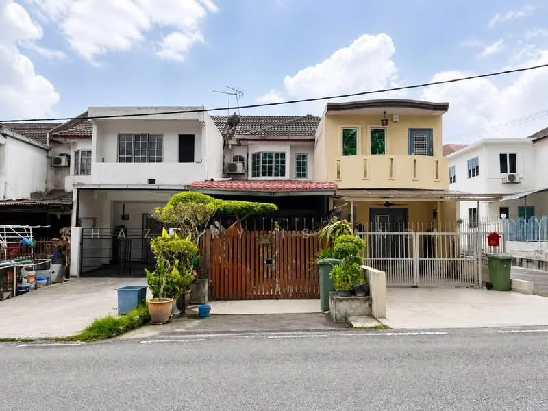 Exterior type: linked terrace house; features: white painted facade, cream painted facade, red tiled roof, single-storey, manicured front garden, fenced front yard, paved driveway, multiple air conditioning units visible, front porch with railing, decorative plants in pots; style: modern.