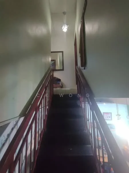 Room features: staircase with wooden railing, dark wood steps, green painted walls, ceiling light fixture, mirror on wall, carpeted landing area; style: traditional.