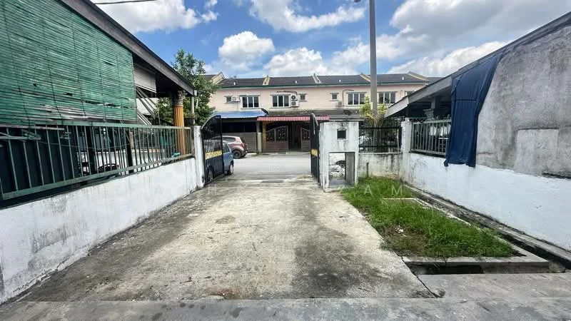 Exterior type: linked terrace house; features: concrete driveway, white painted walls, green wooden fence, grass patch, surrounding residential buildings, paved walkway, utility pole, cloudy sky; style: modern.