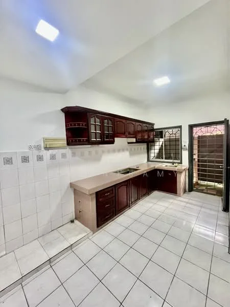Kitchen features: brown wooden cabinetry, white tiled backsplash, light-colored countertop, stainless-steel sink, built-in stove, wall-mounted kitchen hood, ceramic tile flooring, recessed ceiling lights, window with security grille, door leading outside; style: modern.