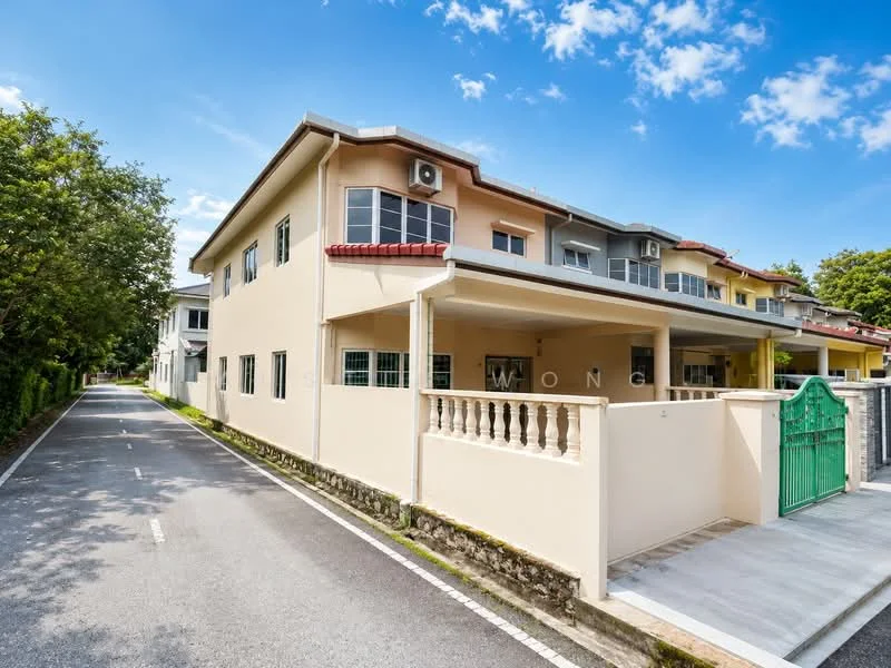 Exterior type: linked terrace house; features: cream painted facade, red tiled roof, covered car porch, green gate, manicured landscaping, paved driveway, 1 wall-mounted split AC, surrounded by mature greenery; style: modern.