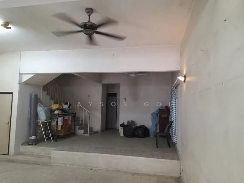 Room features: concrete flooring, white painted walls, ceiling fan, staircase, window with curtains, storage boxes, plastic chairs, shelves with boxes.