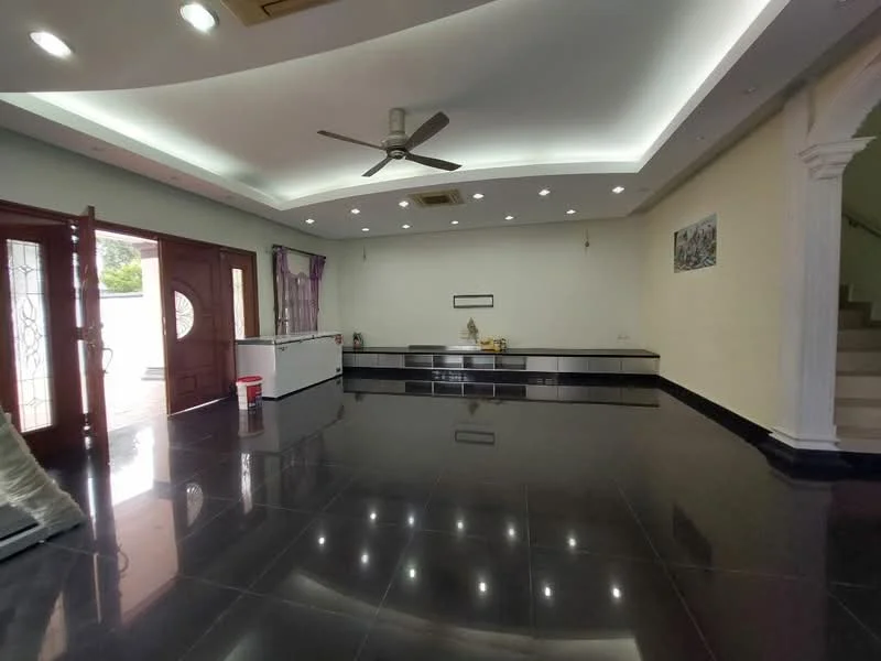 Living features: black polished tile flooring, white painted walls, tray ceiling with recessed lighting, 5-blade ceiling fan, large windows with sheer curtains, double wooden doors with glass panels, built-in cabinetry, decorative wall art, staircase visible in background; style: modern.