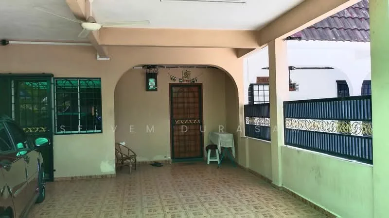 Exterior type: linked terrace house; features: covered car porch, tiled flooring, arched entrance, metal grille windows, ceiling fan, decorative wall paneling, white painted walls, mature landscaping visible, driveway with interlocking pavers; style: modern.