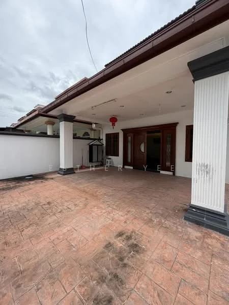 Exterior type: detached bungalow; features: covered porch, textured concrete flooring, white painted walls, dark wood door, large windows, decorative lantern, pillars with black bases, overhanging eaves, gutter system, landscaped garden area; style: modern.