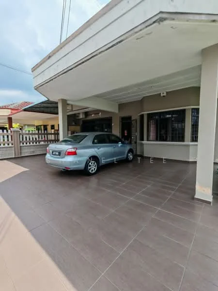 Exterior type: semi-detached house; features: covered car porch, grey tiled flooring, white painted columns, metal grille windows, single-storey, manicured lawn, paved driveway, front fence, overhang roof; style: modern.