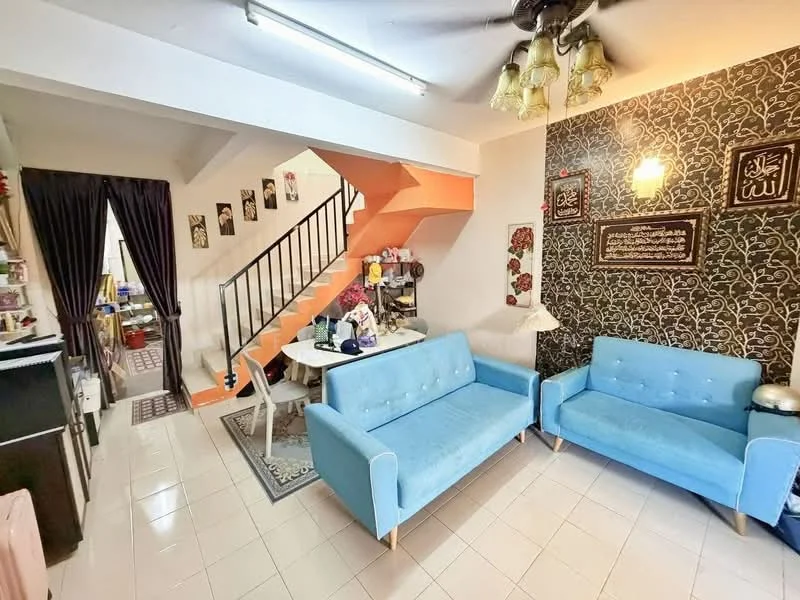Living features: two blue fabric sofas, white tiled flooring, black accent wall with decorative patterns, ceiling fan with light, wall-mounted decorative items, lampshade, staircase with orange risers, decorative wall art, curtains, small side table; style: modern. Room features: open layout, visible kitchen area, dining table in background.