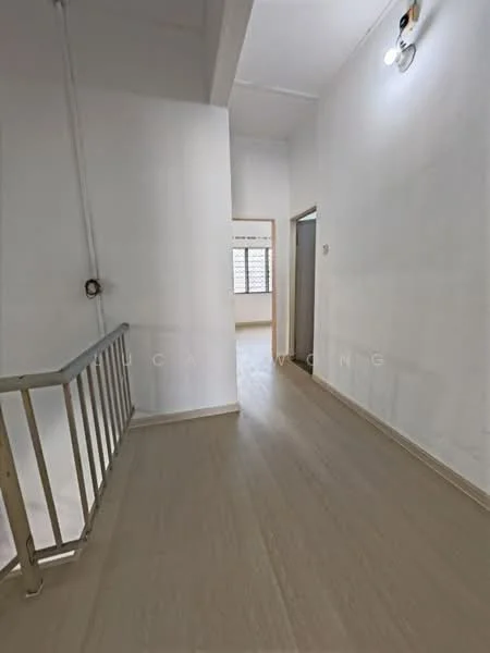 Hallway features: white painted walls, laminate flooring, ceiling light fixture, handrail, window with grid pattern, doorway leading to another room.