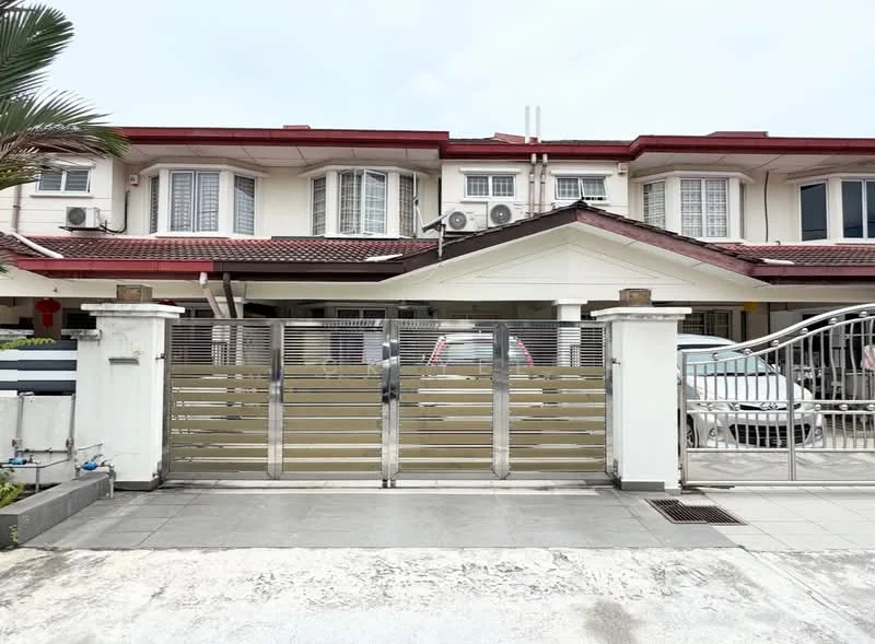 Exterior type: linked terrace house; features: two-storey building, red tiled roof, white painted facade, metal gate with horizontal slats, paved driveway, air conditioning units visible, front porch area, manicured landscaping with palm tree, security grilles on windows, covered entrance, visible car parked in driveway; style: modern.