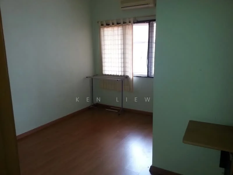 Room features: light green painted walls, laminate flooring, window with sheer curtains, wall-mounted air conditioning unit, metal clothes rack, small desk or table, natural light from window.