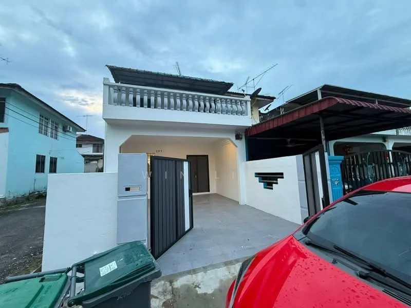 Exterior type: semi-detached house; features: white painted facade, flat roof, balcony with railing, grey tiled flooring at entrance, car porch with awning, manicured lawn, driveway with interlocking pavers, visible antennas on roof; style: modern.
