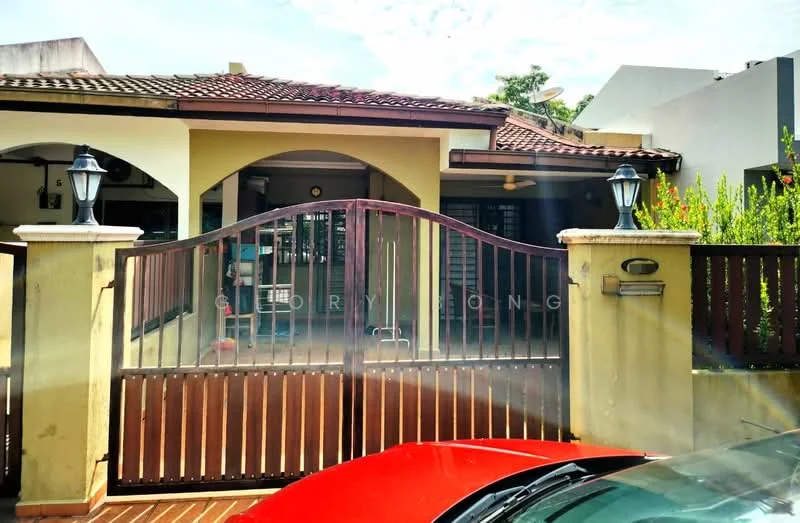 Exterior type: semi-detached house; features: gated entrance, brown wooden gate, cream painted facade, red tiled roof, front porch, landscaped garden, outdoor lighting fixtures, brick driveway, mature greenery; style: modern.