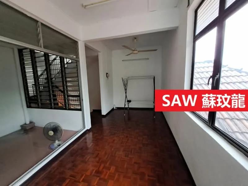 Room features: wooden flooring, white painted walls, ceiling fan, large windows, natural light, open space, staircase visible, clothes rack.