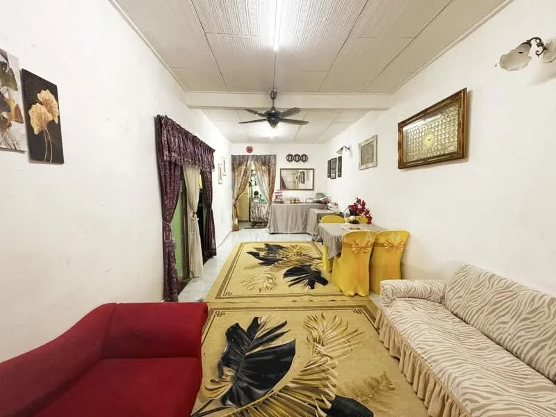 Living features: red fabric sofa, striped fabric sofa, area rug with floral pattern, ceiling fan, wall-mounted artwork, framed mirror, dining table with yellow tablecloth, curtains in green and purple, white painted walls, textured ceiling; style: traditional.