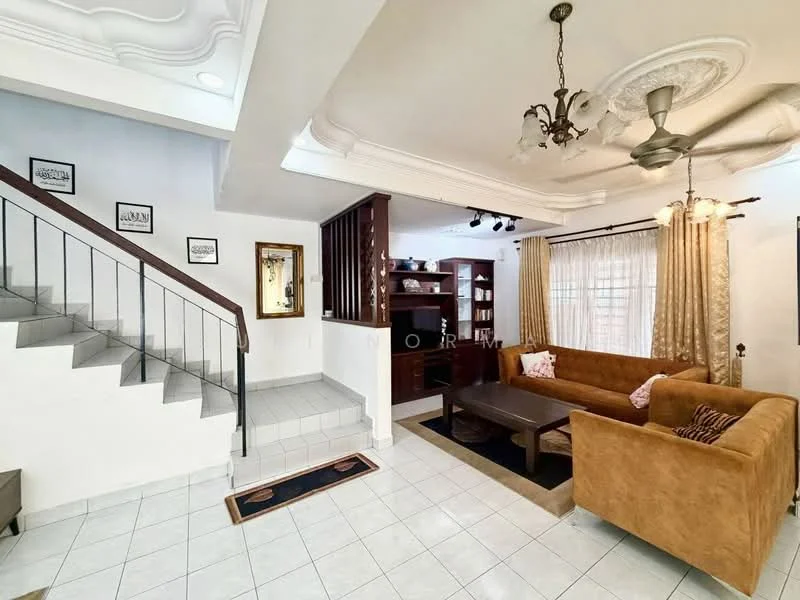 Living features: cream painted walls, white ceiling with decorative moulding, 5-blade ceiling fan with light, large window with sheer curtains, brown fabric sofa, coffee table, TV console with shelving, decorative wall mirror, tile flooring, staircase with wooden railing; style: modern.