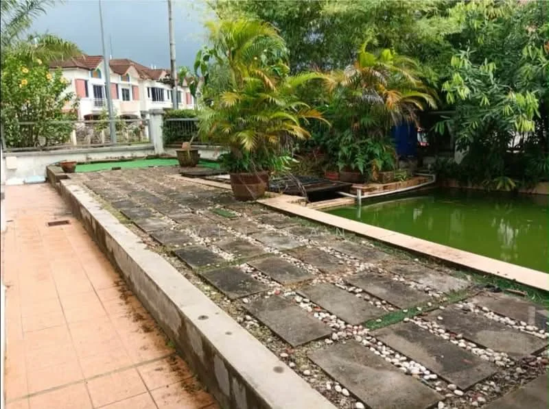 Exterior type: landscape garden; features: stone-paved walkway, manicured lawn, mature palm trees, tropical landscaping, pond with green water, planters with plants, fenced perimeter, adjacent residential houses; style: tropical-modern.