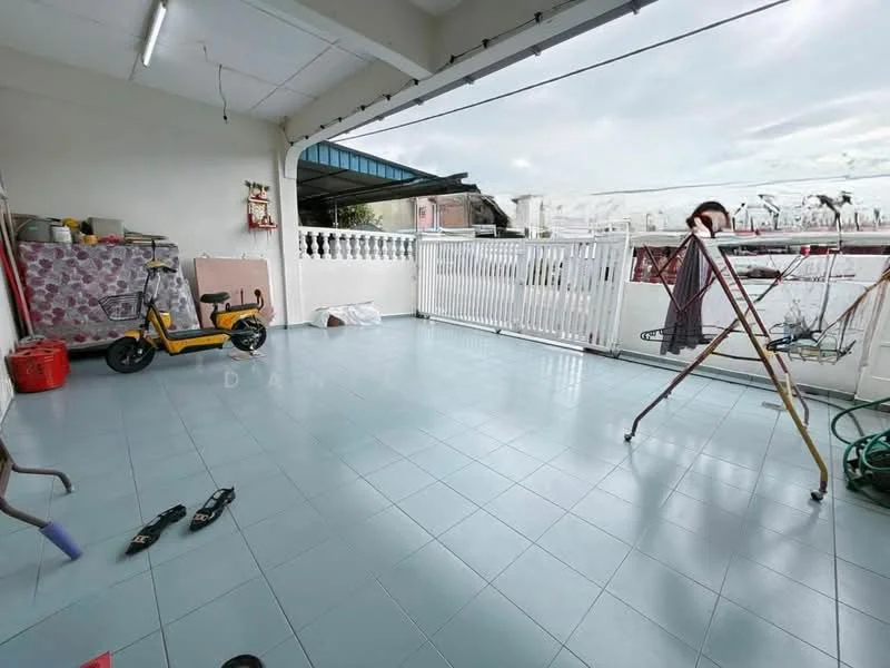 Room features: blue ceramic tile flooring, white railing, clothes drying rack, motorized scooter, plastic storage container, outdoor space, partially covered area, open view.
