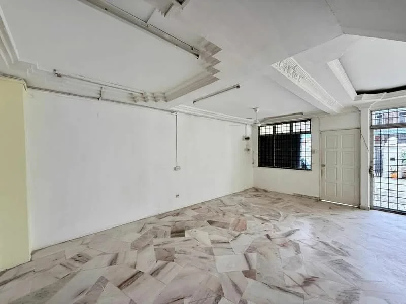 Room features: white painted walls, marble flooring, exposed ceiling with decorative moulding, large windows with metal grilles, door with multiple panels, electrical outlets visible, ceiling lights, open layout; style: modern; view: street.