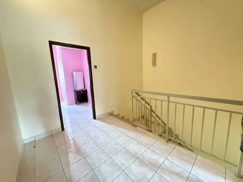 Room features: white painted walls, light-colored tiled flooring, staircase with metal railing, doorway leading to another room, doorway leading to a pink room, window with natural light, ceiling with no visible fixtures.