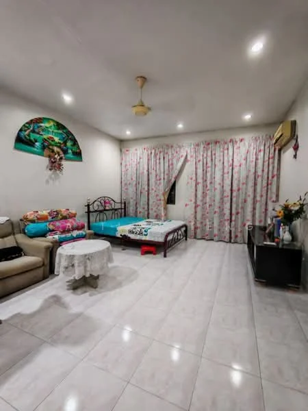 Living features: white painted walls, tile flooring, recessed downlights, ceiling fan, sofa in beige, coffee table, bed with floral bedding, curtains with floral pattern, TV console, decorative plants.