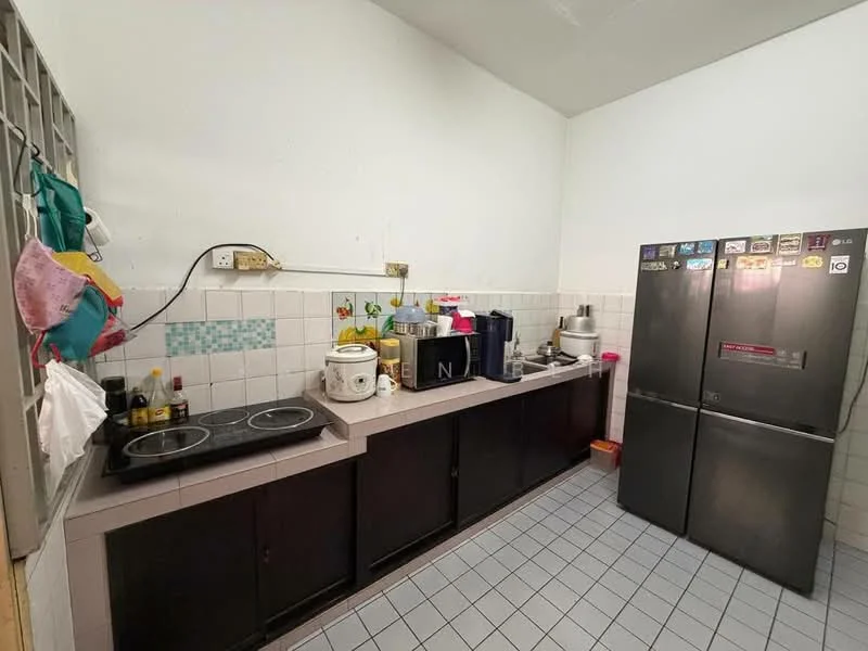 Kitchen features: grey tiled flooring, white painted walls, black cabinetry, stainless-steel fridge, 2-burner electric cooktop, kitchen countertop, kitchen sink, wall-mounted shelves, various kitchen appliances, decorative wall tiles.