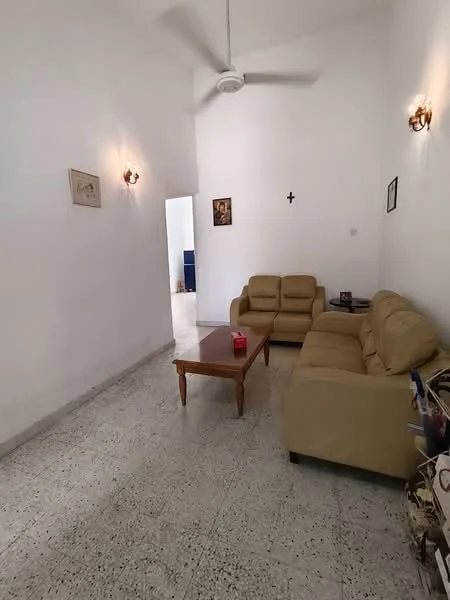 Living features: cream leather sofa, wood coffee table, wall-mounted light fixtures, white painted walls, textured flooring, ceiling fan, decorative wall art, cross wall decoration; style: minimalist.