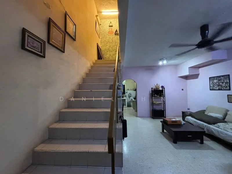 Living features: light-colored walls, textured wall in purple, ceiling fan, sofa, coffee table, decorative wall art, tile flooring, open layout to staircase. Hallway features: staircase with tiled steps, light-colored walls, framed artwork, wall-mounted decor, ambient lighting.