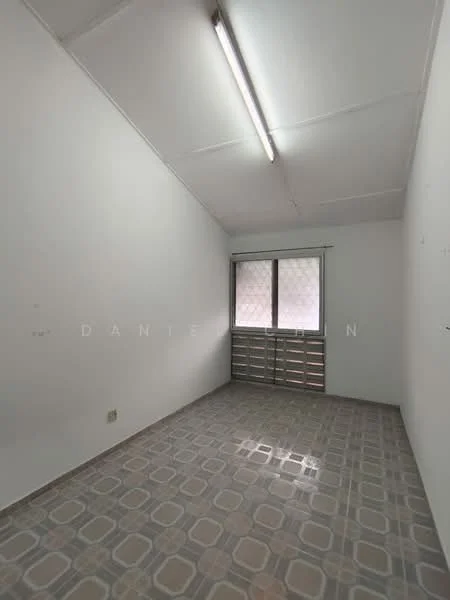Room features: white painted walls, vinyl tile flooring with geometric pattern, single window with grille, fluorescent ceiling light, no visible furniture or decor; style: minimalist.