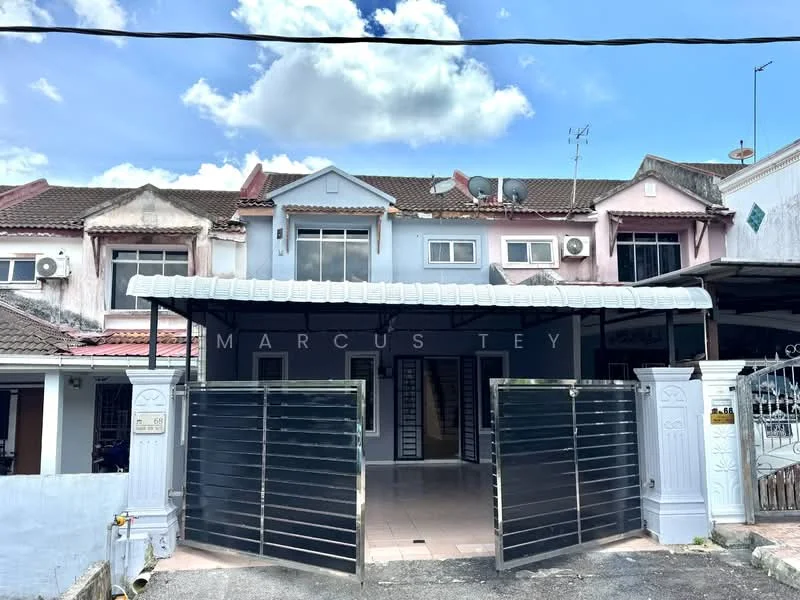 Exterior type: linked terrace house; features: painted facade in pastel colors, metal gate, covered porch area, multiple air conditioning units visible, two-storey structure, gabled roof, front entrance with tiled flooring, decorative elements on upper windows, surrounding pavement, outdoor lighting fixtures; style: modern.