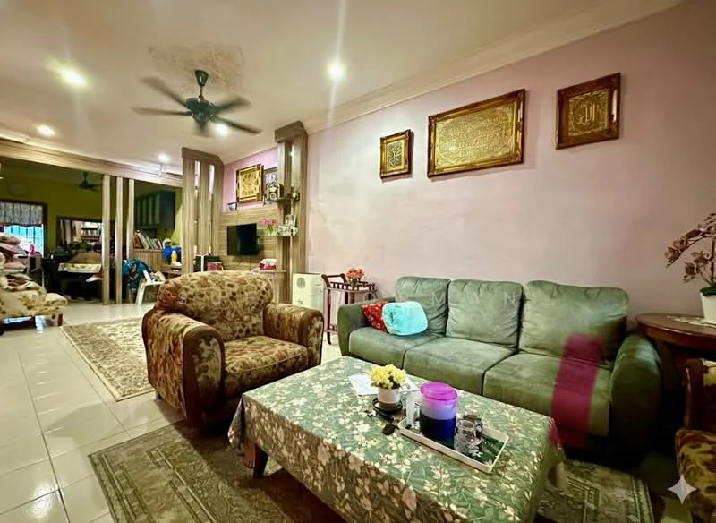Living features: 3-seater fabric sofa in grey, 2-seater fabric sofa with floral pattern, coffee table with decorative items, area rug with geometric pattern, wall-mounted TV, ceiling fan, wall art with gold frames, light purple painted walls, tile flooring, decorative plant in ceramic pot; style: contemporary. Room features: open layout to kitchen, dining area visible in background.