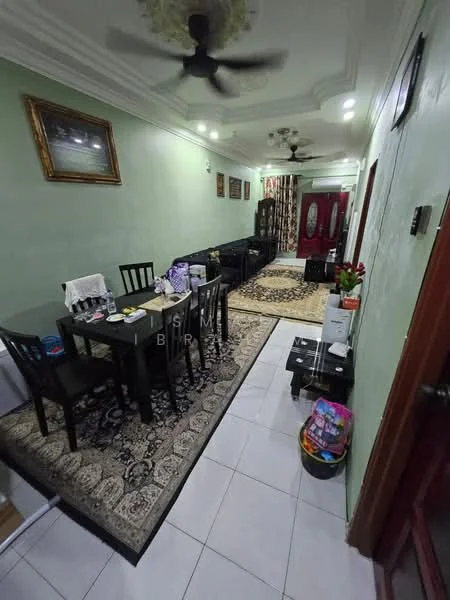 Living features: green painted walls, white ceiling with crown moulding, 5-blade ceiling fan, marble tile flooring, area rug with geometric pattern, black leather sofa, wooden dining table with black chairs, decorative wall art, curtains with floral pattern, wall-mounted TV, coffee table, potted plants, storage cabinet, decorative mirror; style: traditional.