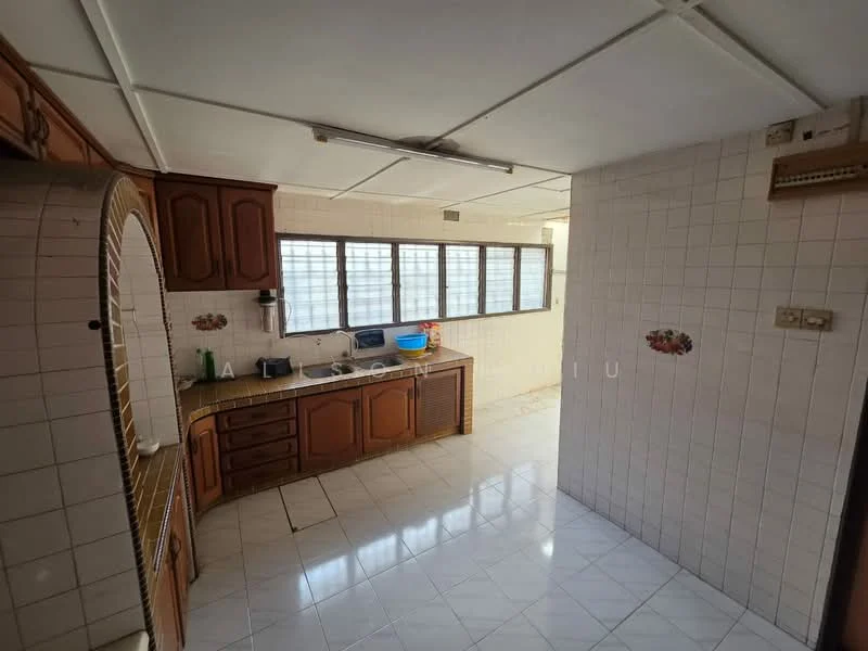 Kitchen features: brown wooden cabinetry, white tiled backsplash, single-bowl stainless-steel sink, chrome pull-down faucet, built-in countertop, white ceramic tile flooring, window with grid pattern, kitchen appliances visible, overhead fluorescent lighting, open layout to adjacent room; style: traditional.