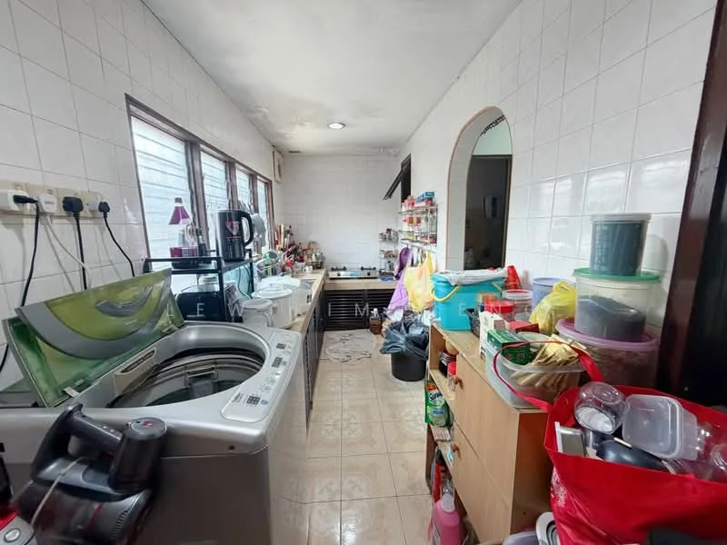 Laundry features: front-load washing machine, top-load washing machine, wooden cabinetry, countertop workspace, white tiled walls, cream tiled flooring, multiple storage containers, sink with faucet, window for natural light, cluttered workspace.