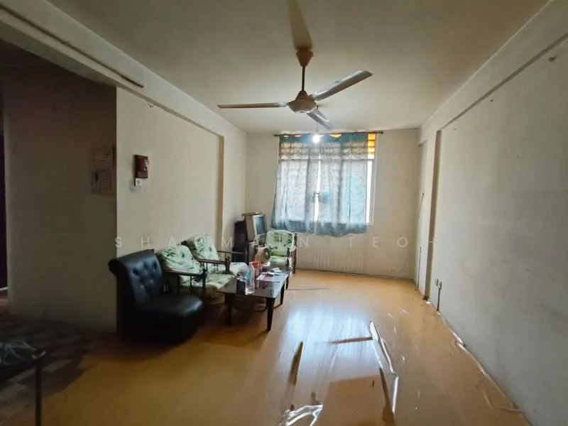 Living features: laminate flooring, white painted walls, ceiling fan, large window with sheer curtains, 2-seater black leather sofa, 3 upholstered chairs, coffee table, side table, decorative items on table.