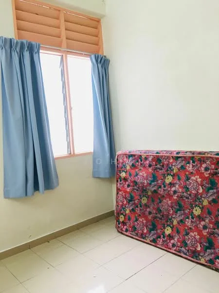 Room features: light-coloured painted walls, window with horizontal slats, blue curtains, tiled flooring, mattress with floral pattern.