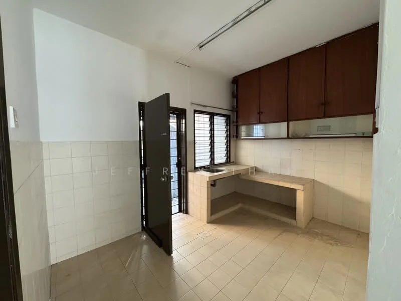 Kitchen features: white tiled walls, cream tiled flooring, brown wooden cabinetry, single-bowl sink, countertop with built-in space, window with horizontal slats, door leading outside, light fixture on ceiling.