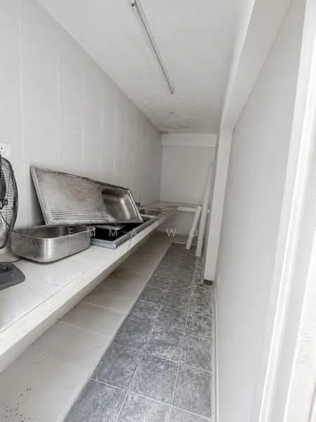 Room features: white tiled walls, grey tile flooring, long countertop, stainless-steel sink, exhaust fan, wall-mounted light fixture; style: minimalist.