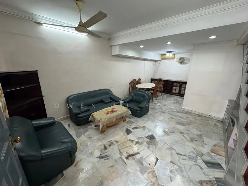 Living features: 2-seater leather sofa in dark green, 3-seater leather sofa in dark green, coffee table with decorative items, marble flooring with mixed patterns, ceiling fan, wall-mounted air conditioning unit, built-in shelving unit, dining table with chairs in background; style: traditional.