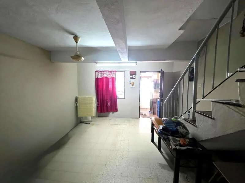 Room features: white painted walls, ceiling with exposed beams, light-colored tiled flooring, single ceiling fan, large window with sheer curtains, red curtain, staircase with metal railing, wooden bench, laundry basket, doorway leading to another room; style: minimalist.